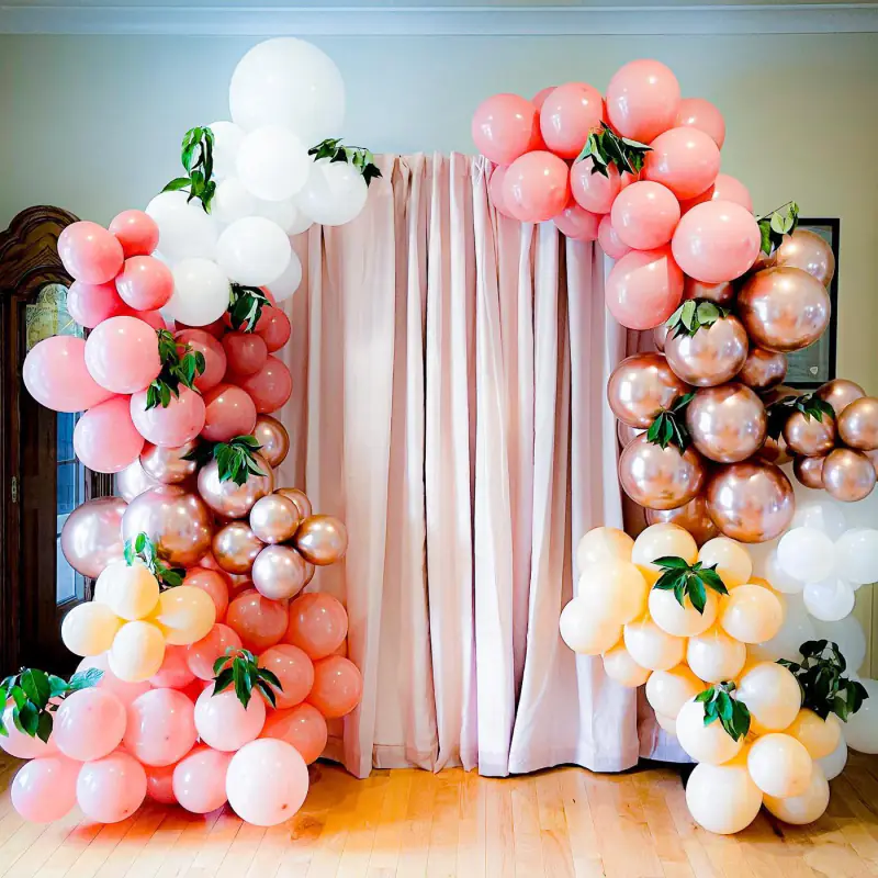 Peach balloon arch with florals